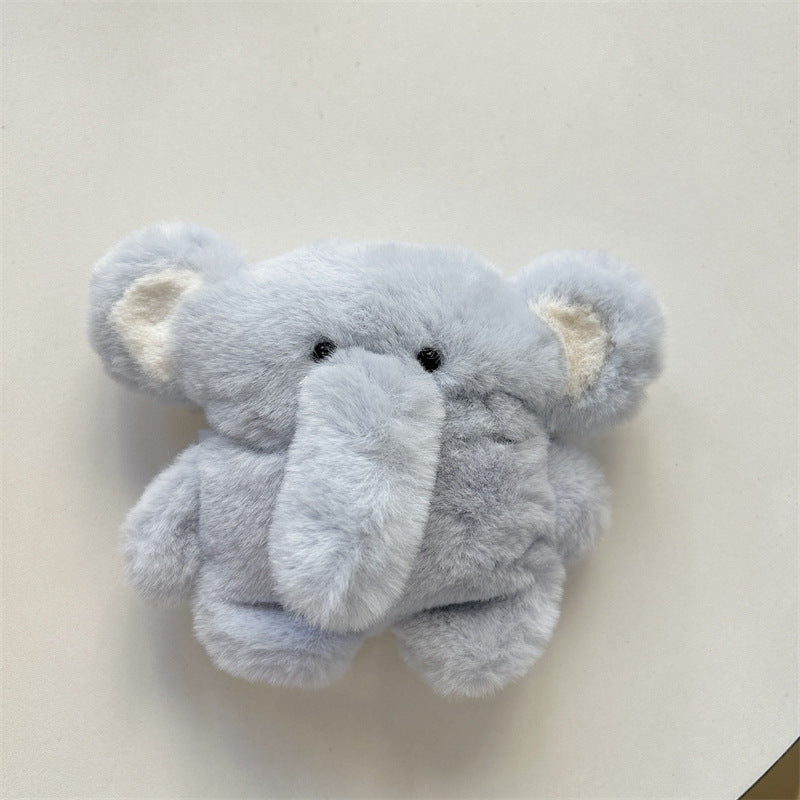 Playful display of the cartoon baby elephant case for AirPods® on a clean, minimalist background.